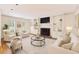 Bright and airy living room with a fireplace, built-in shelves, and neutral decor at 1151 Roxboro Ne Cv, Atlanta, GA 30324