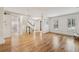Bright living room featuring hardwood floors, large windows with shutters, and traditional architectural details at 1151 Roxboro Ne Cv, Atlanta, GA 30324