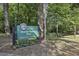Signage for the City of Atlanta's Shady Valley Park amongst the trees at 1151 Roxboro Ne Cv, Atlanta, GA 30324