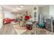 Finished basement featuring a drumset, red couch, wood flooring, and decor at 1461 Radstone Dr, Lawrenceville, GA 30044