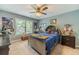 Decorated bedroom with a window, carpet, ceiling fan, and themed decor at 1461 Radstone Dr, Lawrenceville, GA 30044