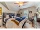 Bedroom featuring a large bed and desk, perfect for work or relaxation at 1461 Radstone Dr, Lawrenceville, GA 30044