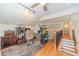 Spacious bonus room featuring hardwood floors, and staircase to other rooms at 1461 Radstone Dr, Lawrenceville, GA 30044