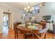 Dining area with a wooden table and view to the living room at 1461 Radstone Dr, Lawrenceville, GA 30044