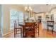 Eat-in kitchen featuring a round wooden table and natural light at 1461 Radstone Dr, Lawrenceville, GA 30044