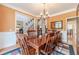 Inviting dining room with hardwood floors, a chandelier, and views to living spaces at 1461 Radstone Dr, Lawrenceville, GA 30044
