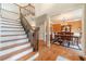Grand foyer with hardwood floors, staircase, and a view into the formal dining room at 1461 Radstone Dr, Lawrenceville, GA 30044