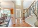 Welcoming entryway with hardwood floors, staircase, and a bright, open atmosphere at 1461 Radstone Dr, Lawrenceville, GA 30044
