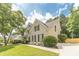Well-manicured lawn and established landscaping add to this home's curb appeal at 1461 Radstone Dr, Lawrenceville, GA 30044