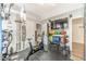 Fully equipped home gym featuring an exercise bike, a TV and various weights at 1461 Radstone Dr, Lawrenceville, GA 30044