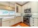 Bright kitchen with a farmhouse sink and stainless steel appliances at 1461 Radstone Dr, Lawrenceville, GA 30044