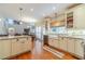 Eat-in kitchen featuring white cabinets and a breakfast bar at 1461 Radstone Dr, Lawrenceville, GA 30044