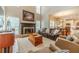 Comfortable living room with fireplace, high ceilings, and an open layout to kitchen at 1461 Radstone Dr, Lawrenceville, GA 30044