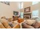 Bright living room with a fireplace and comfortable seating at 1461 Radstone Dr, Lawrenceville, GA 30044