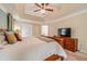 Spacious bedroom with a ceiling fan, trey ceilings, and plush carpet at 1461 Radstone Dr, Lawrenceville, GA 30044
