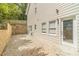 Back patio features siding, windows, a brick wall, and a glass paned door at 1461 Radstone Dr, Lawrenceville, GA 30044