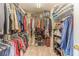 Organized walk-in closet with ample shelving and hanging space, perfect for storage at 1461 Radstone Dr, Lawrenceville, GA 30044