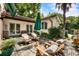 A cozy outdoor area with ample seating, beautiful plantings, and views of the main house at 2837 N Hills Ne Dr, Atlanta, GA 30305