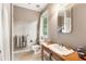 Well-lit bathroom features wood vanity, classic fixtures, and a neutral color palette at 2837 N Hills Ne Dr, Atlanta, GA 30305
