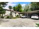 A house with a carport area features parking for two cars and landscaping at 2837 N Hills Ne Dr, Atlanta, GA 30305
