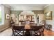 Formal dining room with large round table, terra cotta tile floor, and decorative columns at 2837 N Hills Ne Dr, Atlanta, GA 30305