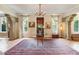 Spacious foyer features arched columns, terracotta floors, and decorative rug at 2837 N Hills Ne Dr, Atlanta, GA 30305
