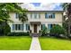 Charming two-story home with blue shutters, lush lawn, and mature trees giving great curb appeal at 2837 N Hills Ne Dr, Atlanta, GA 30305