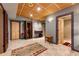 A tiled hallway with wood trim and an ornate area rug provides access to multiple rooms at 2837 N Hills Ne Dr, Atlanta, GA 30305