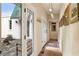 Hallway view to outdoor courtyard with seating, with artwork and entry doors at 2837 N Hills Ne Dr, Atlanta, GA 30305