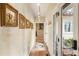 Hallway with terra cotta tile, artwork, and glass doors leading to an outdoor space at 2837 N Hills Ne Dr, Atlanta, GA 30305