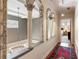 Elegant hallway with decorative columns, high ceilings, hardwood floor and chandelier at 2837 N Hills Ne Dr, Atlanta, GA 30305