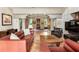 Spacious living room with terracotta floors, columns, and comfortable leather furniture at 2837 N Hills Ne Dr, Atlanta, GA 30305