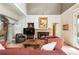 Comfortable living room featuring a stone fireplace and access to the outdoors at 2837 N Hills Ne Dr, Atlanta, GA 30305