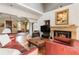 Bright living room featuring a stone fireplace and comfortable leather furniture at 2837 N Hills Ne Dr, Atlanta, GA 30305