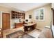 Home office features custom wood cabinets, earth-toned tile flooring, and large windows for natural light at 2837 N Hills Ne Dr, Atlanta, GA 30305