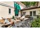 Charming patio area with stone pavers, comfortable seating, and lush green landscaping at 2837 N Hills Ne Dr, Atlanta, GA 30305