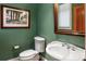 Cozy powder room features an elegant sink, a modern toilet, and tasteful decor at 2837 N Hills Ne Dr, Atlanta, GA 30305