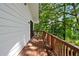 This cozy covered back porch offers views of the surrounding greenery at 4214 Williamsburg Dr, College Park, GA 30337
