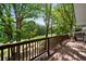 Spacious deck overlooking a lush yard surrounded by mature trees offers privacy at 4214 Williamsburg Dr, College Park, GA 30337