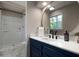 Bathroom featuring new vanity, white countertops, and walk-in shower at 4214 Williamsburg Dr, College Park, GA 30337
