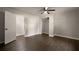 Bedroom with hardwood floors, ceiling fan, closet and open door to another room at 4214 Williamsburg Dr, College Park, GA 30337