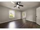 Bedroom with hardwood floors, ceiling fan and two windows providing natural light at 4214 Williamsburg Dr, College Park, GA 30337