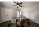 Bedroom features hardwood floors, ceiling fan, and spacious closet at 4214 Williamsburg Dr, College Park, GA 30337