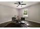 Bedroom features hardwood floors, ceiling fan, and a large window at 4214 Williamsburg Dr, College Park, GA 30337