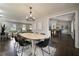 Open-concept layout of the dining room, with a view into the living room and kitchen, offering a spacious feel at 4214 Williamsburg Dr, College Park, GA 30337