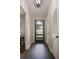 Inviting entryway featuring hardwood floors, a stylish light fixture, and a door with glass panes at 4214 Williamsburg Dr, College Park, GA 30337