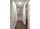 Hallway with wood floor leading up to stairs and other rooms in the house at 4214 Williamsburg Dr, College Park, GA 30337