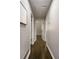 Hallway with wood floors, light gray walls, and white trim, leading to other rooms in the house at 4214 Williamsburg Dr, College Park, GA 30337