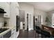 Well-appointed kitchen with stainless steel refrigerator, double oven, and granite countertops at 4214 Williamsburg Dr, College Park, GA 30337