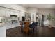 Bright eat-in kitchen with white cabinets, granite counters, stainless appliances, and an island with seating at 4214 Williamsburg Dr, College Park, GA 30337